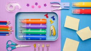 school supplies on blue and purple background